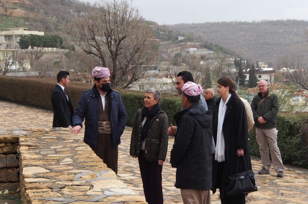 A group of people standing on a stone path

Description automatically generated with low confidence